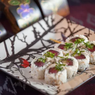 a plate of sushi on a table