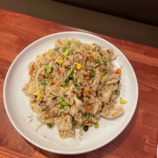 a plate of fried rice and vegetables