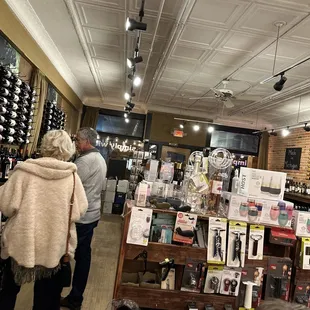 people shopping in a wine store