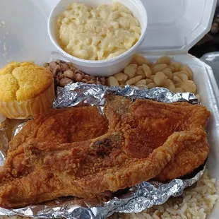 Fried Pork Chops, Mac and cheese, butter beans, black eyed peas and rice and gravy with a cornbread muffin