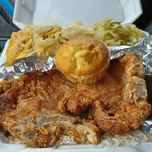 Sweet baby Jesus. Fried pork chops, rice and gravy, fried cabbage, cheesy broccoli and rice and cornbread.