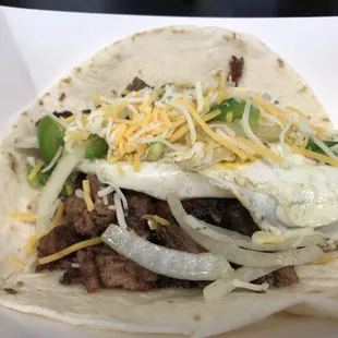 Our newest Tacos Brisket, , Cheese, Pico De Gallo, Over Easy Egg.