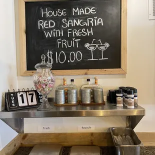 a chalkboard with a price list on it