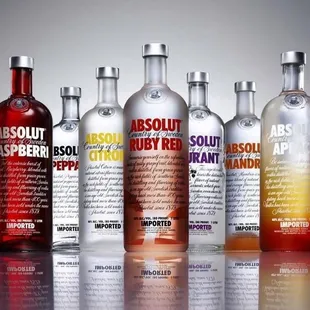 a row of absolut vodka bottles