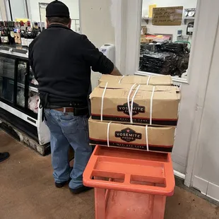 a man unloading boxes