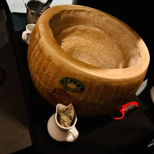 a large wooden bowl with a fork in it