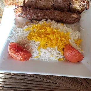 Barg Soltani (beef kabob) with rice and grilled tomatoes