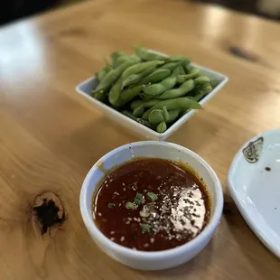 Edamame and side of spicy sauce