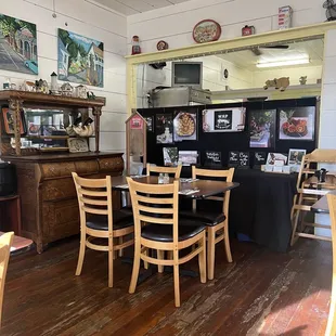 a dinning room with a table and chairs