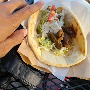 Lamb and beef gyro. Needs more filling or a smaller wrap. Tasted good, but too much breading in the way.