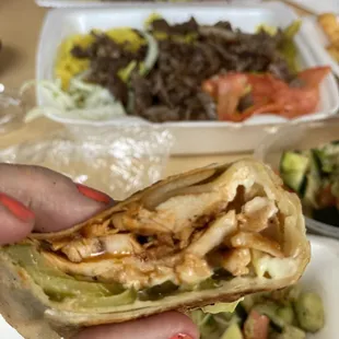 Traditional chicken shawarma in forground; beef shawarma with rice in background