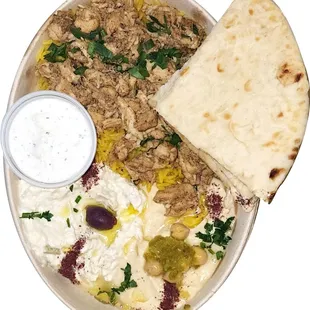 Served with rice, hummus, babaganoush, tzatziki, and pita bread.
