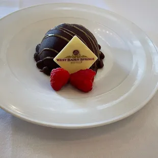 a chocolate dessert with raspberries