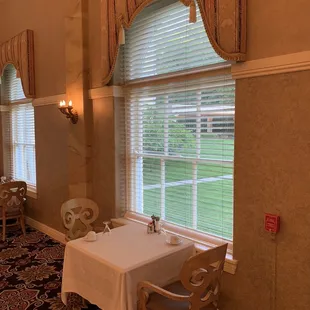 a dining room with a table and chairs