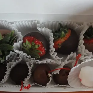 Small box of milk and dark chocolate strawberries mixed with milk, dark and white chocolate cherries.