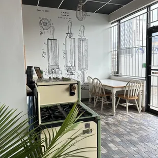 a kitchen with a table and chairs