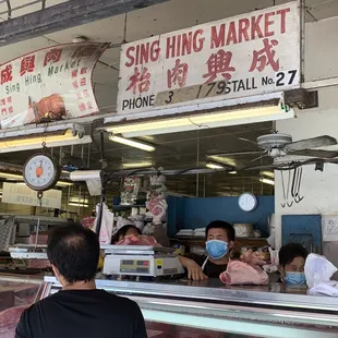 a group of people sitting at a counter