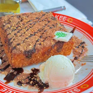 a piece of cake and ice cream on a plate