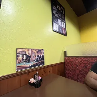 a man sitting at a table in a restaurant