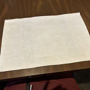 white paper with pretty placemat hidden under it.