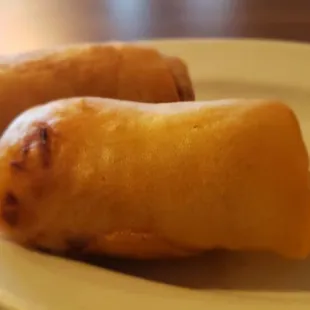 two rolls of food on a plate