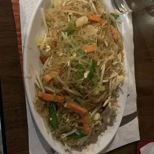 a plate of noodles and carrots