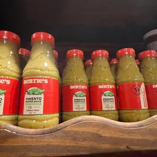 a row of bottles of mustard