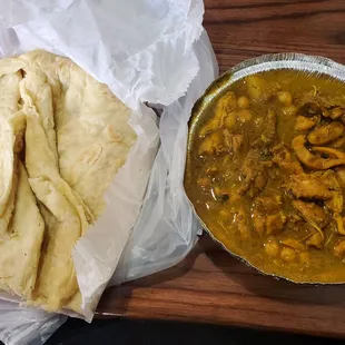 Boneless curry chicken with roti.