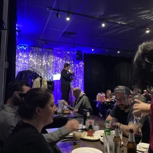 a group of people sitting around a table