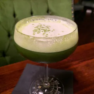 a green drink in a glass