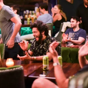 a group of people sitting around a table