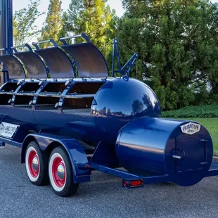 a blue truck with a large grill on the back