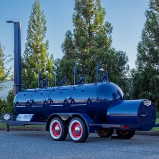 a blue truck with red wheels