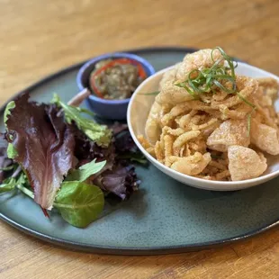 Garlic chicharron with smoked eggplant relish