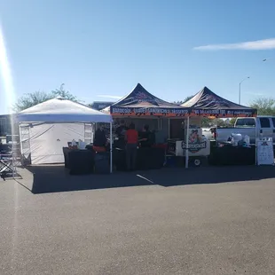 a tent set up in a parking lot