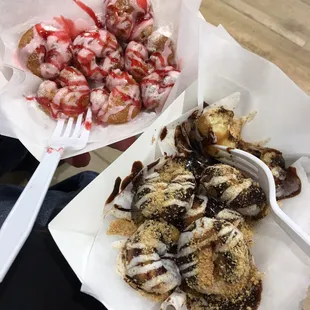 a plate of doughnuts and a bowl of strawberries