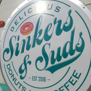 Sign/log on side of vintage trailer. Easy to spot across a parking lot!