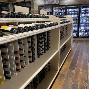 rows of wine bottles on shelves