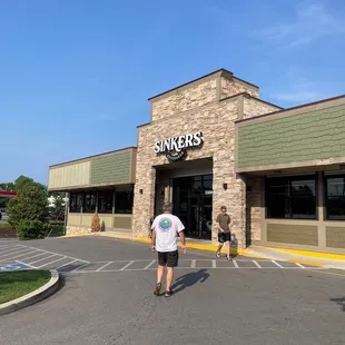 a woman walking in front of a store