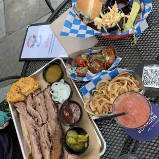 Brisket sandwich, brisket meal full order, heavenly tots, onion straws and blood orange margarita