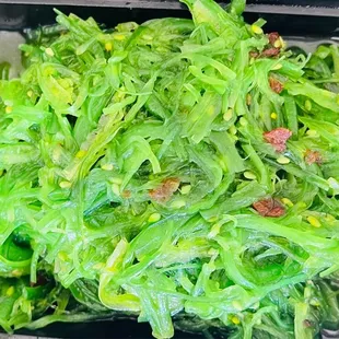 a close up of a salad in a plastic container