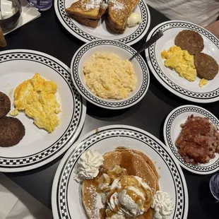 Cinna-Bomb Pancakes,  Veggie Sausage Side, Fried Chicken &amp; French Toast sandwich, cheese grits and Corned Beef Hash Side