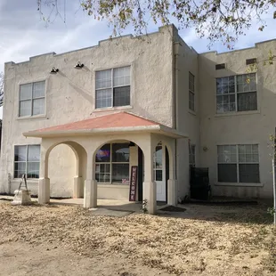 a white building with a red roof