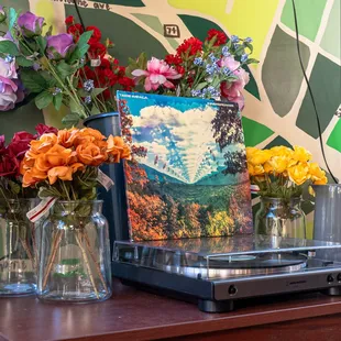 Record Player is always connected, bring your own record and enjoy or put one of ours on for a spin.