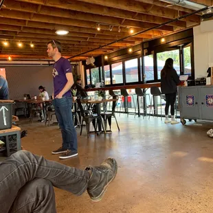 a man sitting on a bench in a coffee shop