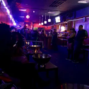 a group of people sitting at a bar