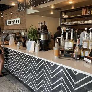 a woman sitting at the counter