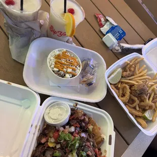 Pina Coladas from the main bar. Brisket elote from Vibe Taco. Calamari from Bayou Bistro. Pepper Steak Nachos from Wok On