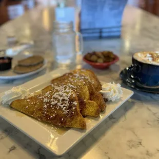 Bourbon Maple French Toast, banana foster latte, Side Home Fries, Side of Pork Sausage.