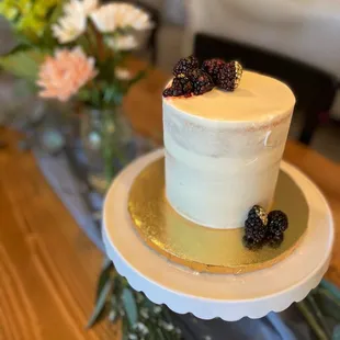 a cake with berries on top